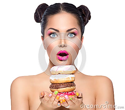 Beauty girl taking stack of colorful donuts Stock Photo