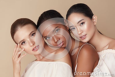 Beauty. Group Of Diversity Models Portrait. Multi-Ethnic Women With Different Skin Types Posing On Beige Background. Tender Stock Photo