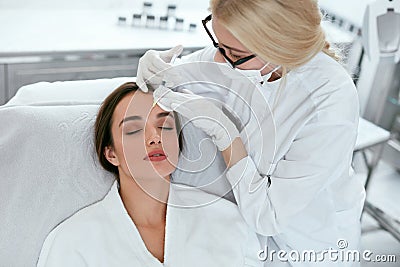 Beauty Injections. Woman On Rejuvenation Procedure In Clinic Stock Photo