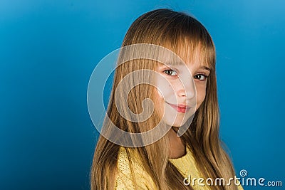 Beauty or kid fashion with cosmetics and healthy hair. Stylish girl with pretty face. Little girl with long hair Stock Photo
