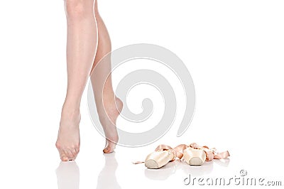 Beauty legs of ballerina standing on tiptoes near pointes. Stock Photo