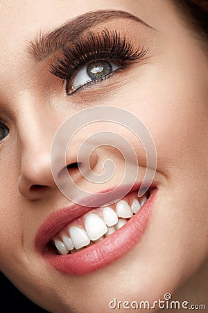 Beauty Makeup. Closeup Beautiful Woman Face With Perfect Smile Stock Photo
