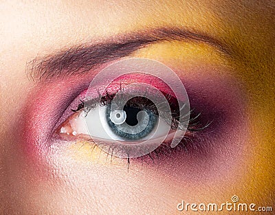 Beauty makeup yellow magenta eyes retouched skin Stock Photo