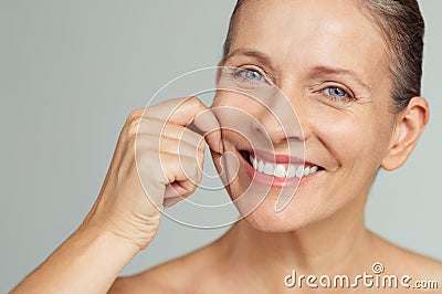 Beauty mature woman pulling perfect skin Stock Photo