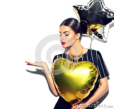 Beauty model girl with colorful balloons showing empty copy space on open hand palm Stock Photo