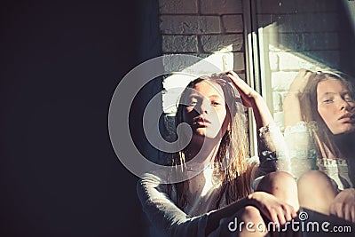 Beauty model with wet blond hair. Sensual woman relax at window. Woman with young skin face. Albino girl with look Stock Photo