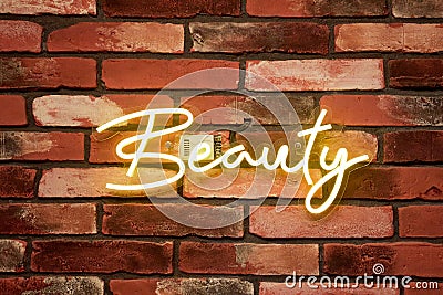 beauty - neon sign on a brick wall in a spa salon Stock Photo