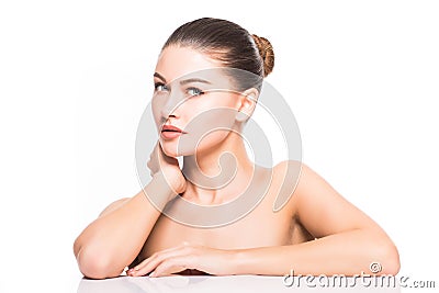 Beauty Portrait. Beautiful Spa Woman Touching her Face. Perfect Fresh Skin. Isolated on White Background. Pure Beauty Stock Photo