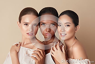 Beauty. Portrait Of Diversity Models. Mixed Race, Asian And Caucasian Girls Hugs Each Other And Looking At Camera. Stock Photo