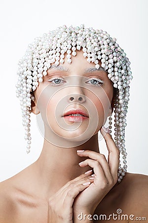 Beauty portrait of women with pearl crown. White and cold make-up Stock Photo