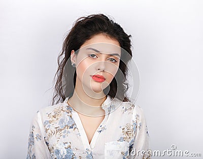 Beauty portrait of young adorable fresh looking brunette woman with long brown healthy curly hair. Emotion and facial expression c Stock Photo