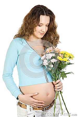 Beauty pregnant brunette with flower Stock Photo