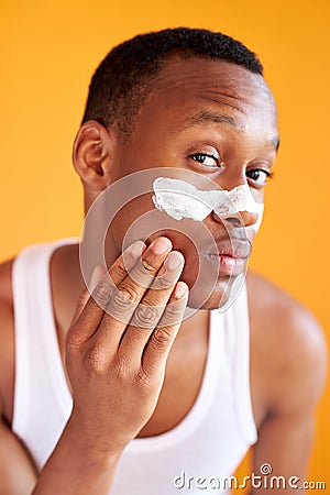 Beauty procedure and skin care, young manful man with face mask on around nose zone Stock Photo