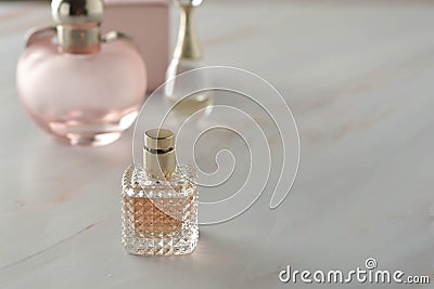 Beauty products. Perfume or parfume bottle on marble background. Copy space. Stock Photo