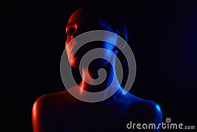 Woman silhouette. Beautiful Girl in color bright lights Stock Photo