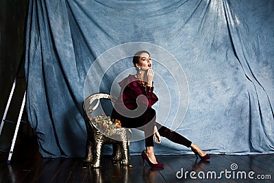 Beauty rich brunette woman in luxury interior near empty frames, vintage elegance brunette stylish Stock Photo