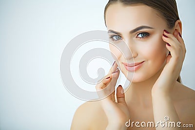 Beauty Skin Care. Beautiful Woman Applying Cosmetic Face Cream Stock Photo