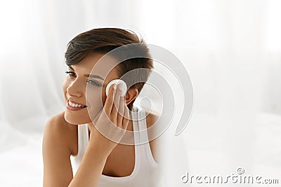 Beauty Skin Care. Woman Removing Face Makeup Using Cotton Pad Stock Photo