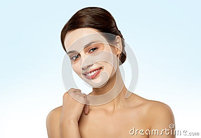 Beautiful young woman with hydrogel mask on face Stock Photo