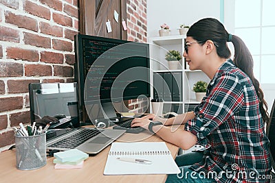 Beauty smiling female programmer using computer Stock Photo