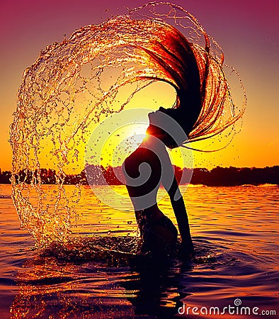 Beauty splashing water with her hair Stock Photo