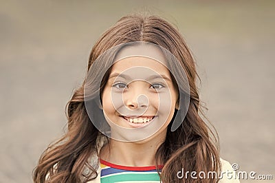 Beauty for tomorrow. Happy beauty smile grey background. Beauty look of little girl. Small kid with long hair. Beauty Stock Photo