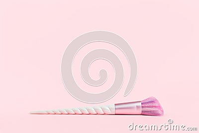 Beauty unicorn makeup brush on monochrome pink Stock Photo