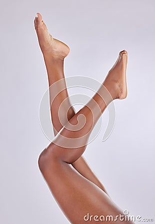 Beauty, wellness and legs of woman on studio floor for shaving, grooming and hair removal. Skincare, underwear and Stock Photo