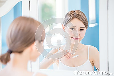 Woman apply cream with neck Stock Photo