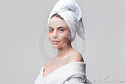 Beauty woman with eye patches showing an effect of perfect skin. Close up portrait of a charming young woman applying on Stock Photo