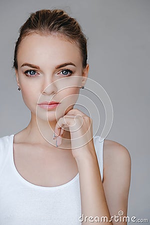 Beauty woman face blue eyes healthy skin closeup natural makeup Stock Photo