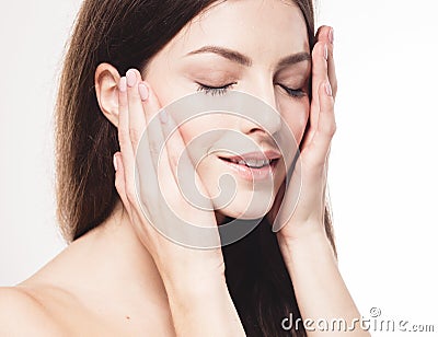 Beauty Woman face Portrait. Beautiful model Girl with Perfect Fresh Clean Skin. Stock Photo