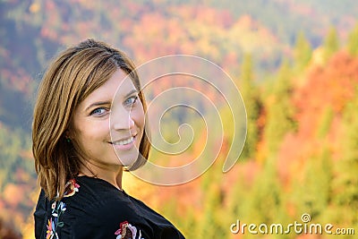 Beautiful Woman face Portrait with autumn landscape background Stock Photo