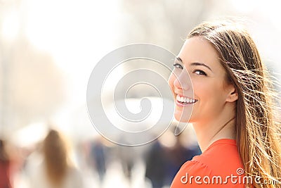 Beauty woman with perfect smile and white teeth on the street Stock Photo