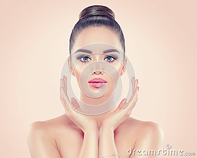 Beauty woman portrait. Pretty young woman touching her face. Skincare Stock Photo