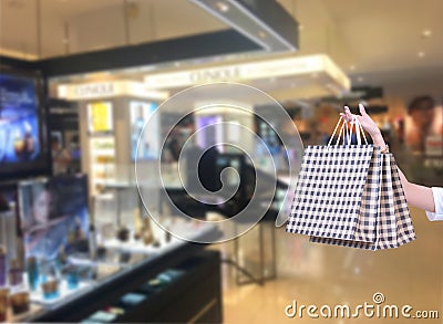 Beauty Woman with Shopping Bags in Shopping Mall. Shopper. Sales. Stock Photo