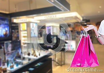 Beauty Woman with Shopping Bags in Shopping Mall. Shopper. Sales. Stock Photo