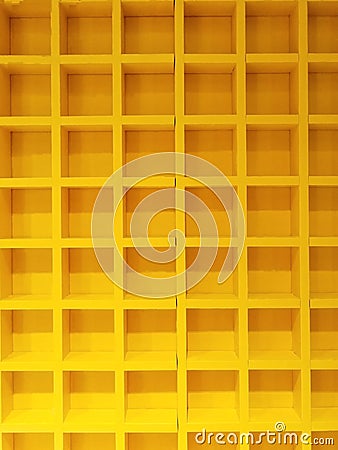 Beauty yellow square same pattern wooden block box shelves. interier decoration design in building house. no people. multi lines c Stock Photo