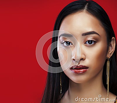 Beauty young asian girl with fashion make up on red background , beauty stylish look Stock Photo