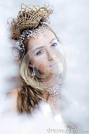 Beauty young snow queen in fairy flashes Stock Photo