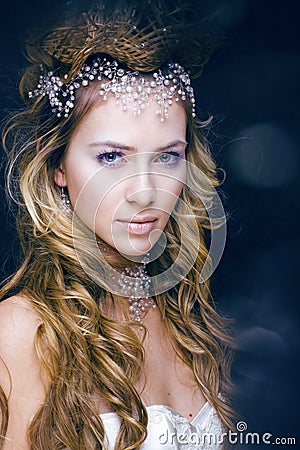 Beauty young snow queen in fairy flashes Stock Photo