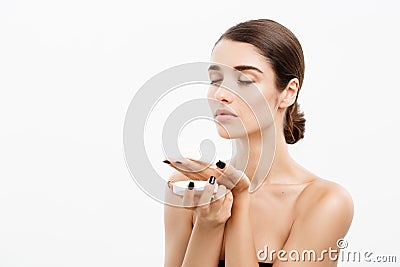 Beauty Youth Skin Care Concept - Beautiful Caucasian Woman Face Portrait smiling and holding cream jar for body and skin Stock Photo