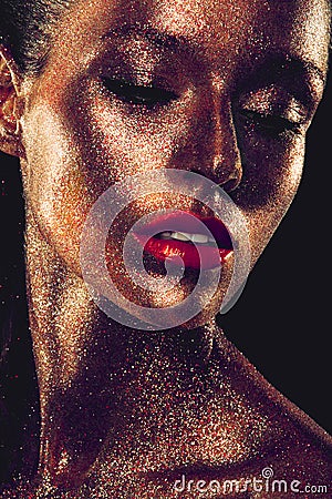 Beautyful girl with gold glitter on her face Stock Photo