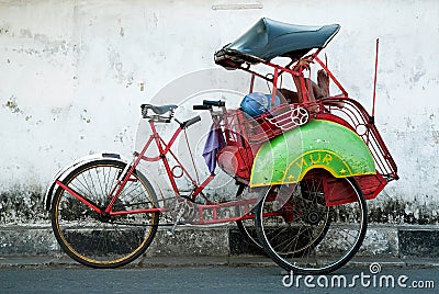 Becak cyclo rider resting yogyakarta java indonesia Editorial Stock Photo