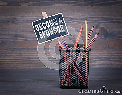 Become a Sponsor. A small blackboard chalk and colored pencil on wood background Stock Photo