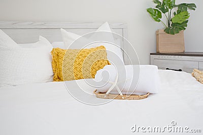 bed decor, rolled white bath towel Stock Photo