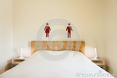Bed with gender symbol Stock Photo