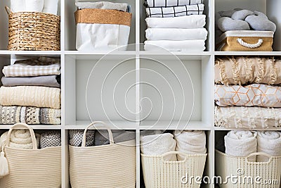 Bed linens closet neatly arrangement on shelves with copy space domestic textile Nordic minimalism Stock Photo