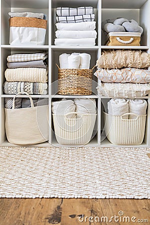 Bed linens closet neatly arrangement on shelves with copy space domestic textile Nordic minimalism Stock Photo