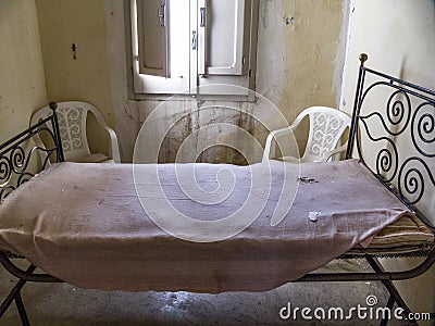 Bed and mattress ruined in ruinous room Vector Illustration